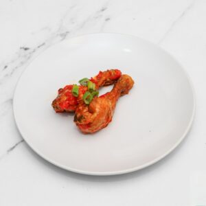 A classic, perfectly seasoned chicken drumstick, ready to enjoy.