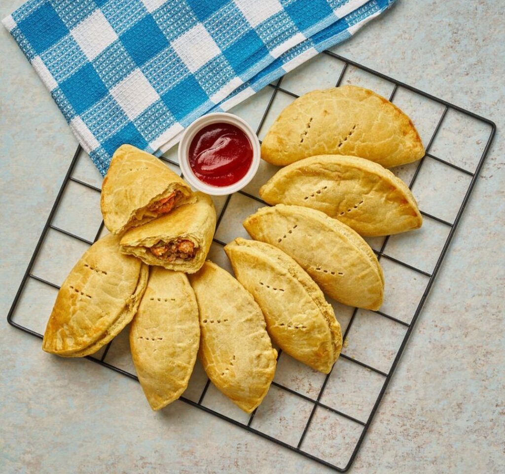 Classic Meat Pie: Flaky pastry filled with savory seasoned minced meat. A perfect individual comfort snack.