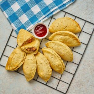Classic Meat Pie: Flaky pastry filled with savory seasoned minced meat. A perfect individual comfort snack.